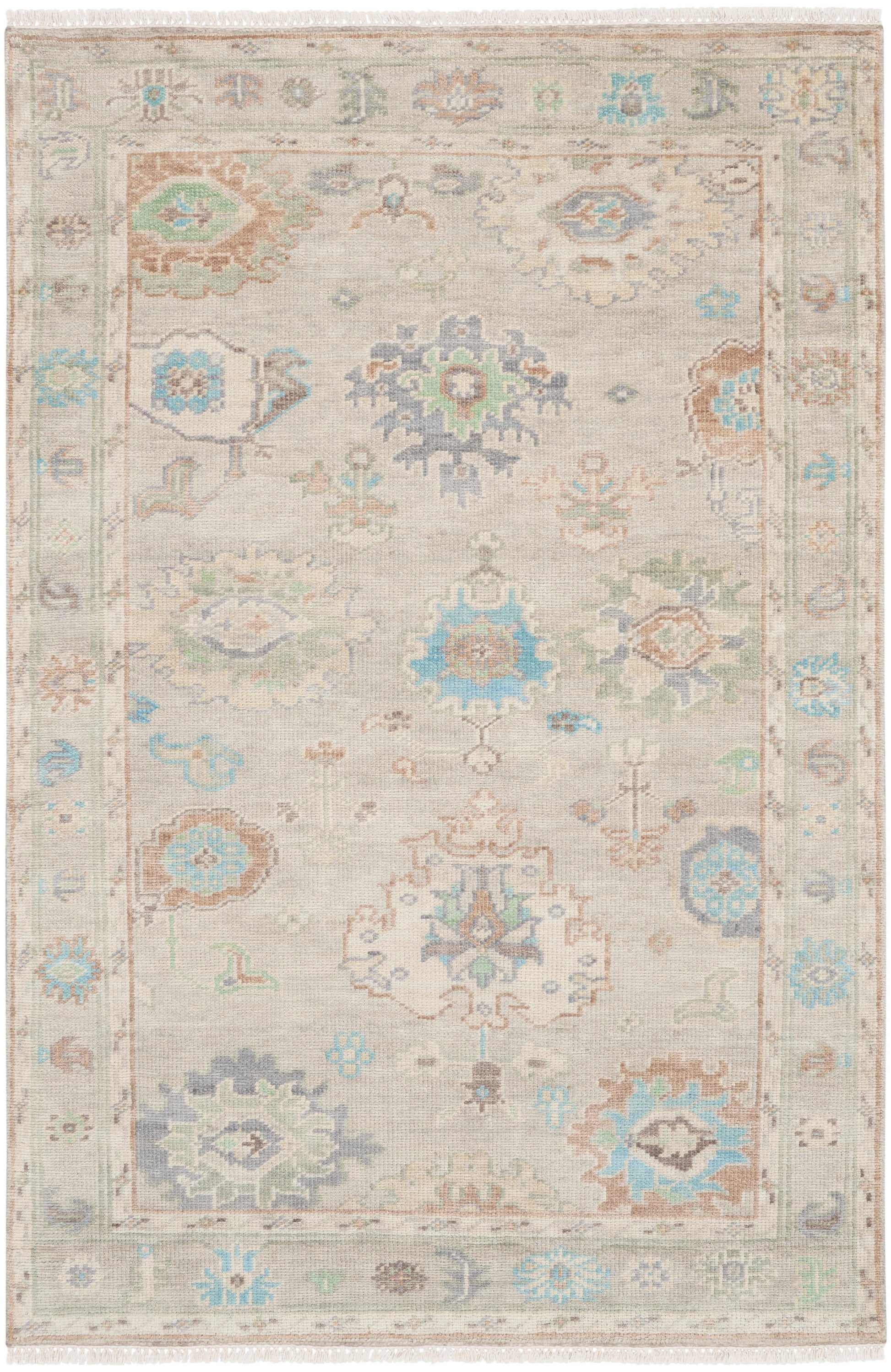 Beige oriental rug with pastel blue and teal floral medallions; intricate border and fringed ends.
