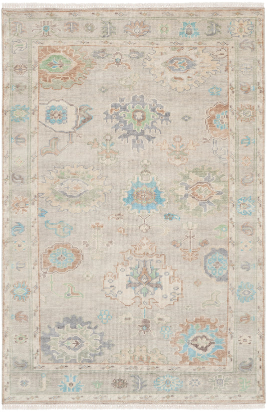 Beige oriental rug with pastel blue and teal floral medallions; intricate border and fringed ends.