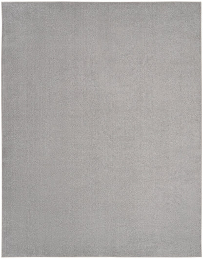Light gray plush area rug, rectangular with a soft velvety pile; modern neutral floor accent.