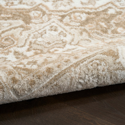 Cream and beige patterned rug with a thick plush pile, folded edge resting on dark wood floor.