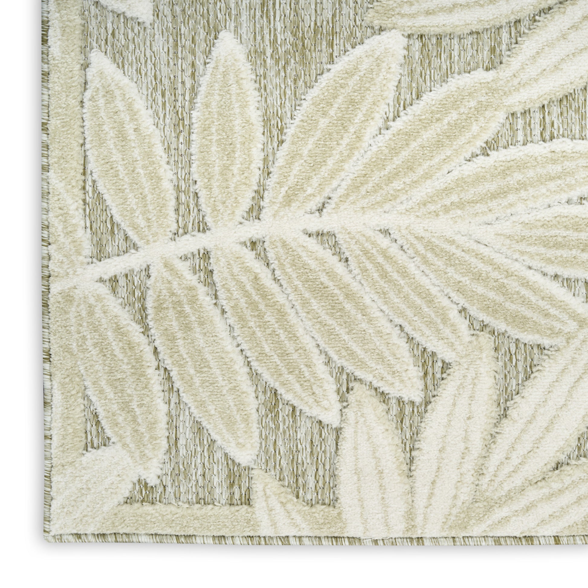 Cream-toned woven rug with a raised ivory leaf motif on a striped textured background.