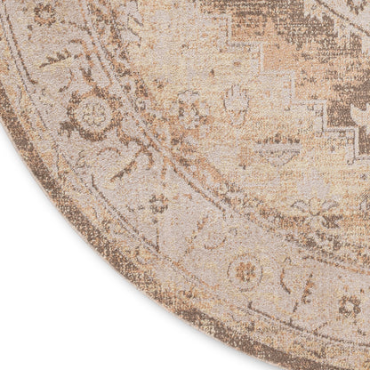 Round beige rug with distressed vintage oriental medallion pattern in tan and cream tones.