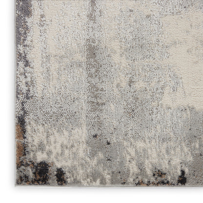 Neutral abstract area rug in beige, gray, and taupe with a plush distressed pattern.