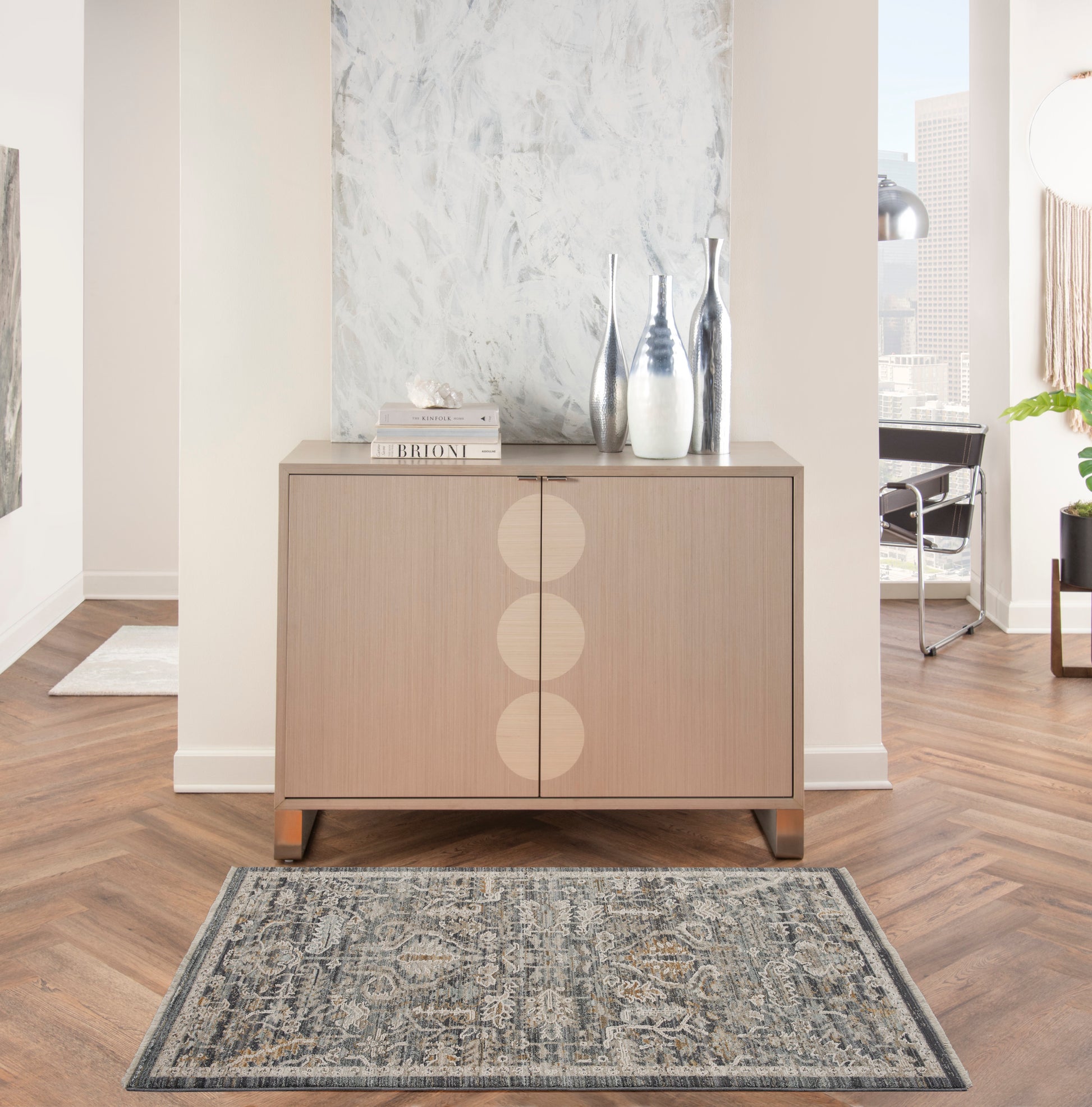 Beige rug, 3' x 5', in a modern living room with a marble wall.