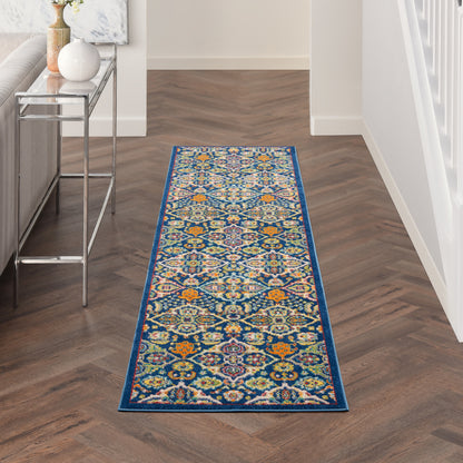 Vibrant geometric hallway runner rug with blue border on dark herringbone floor, modern decor.