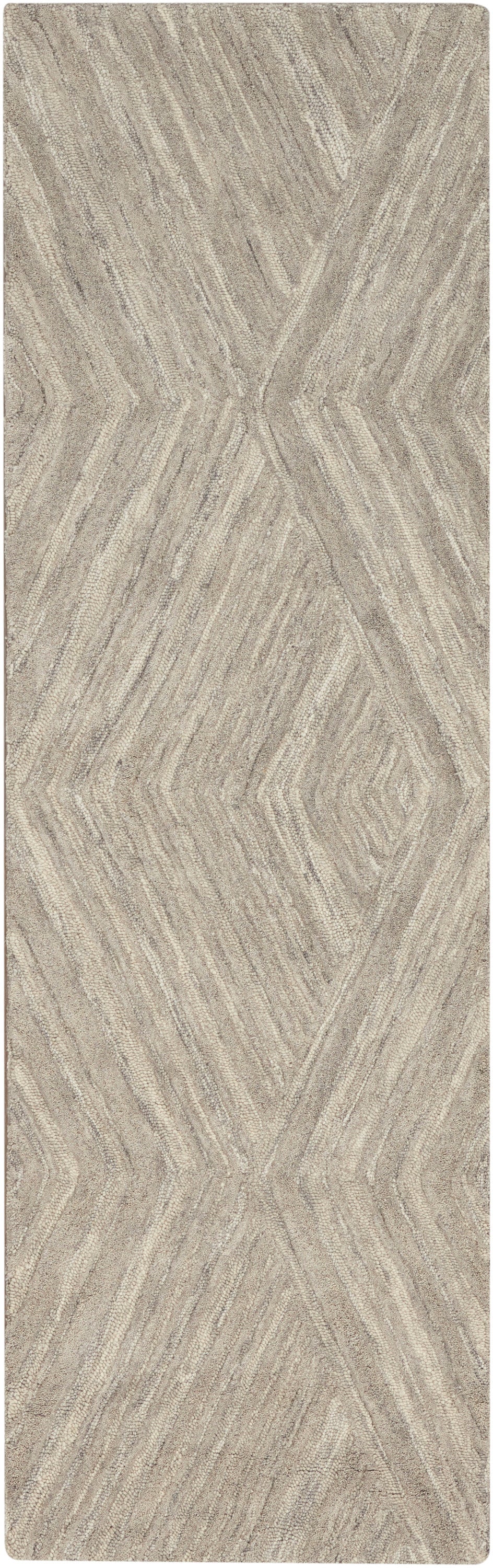 Beige textured runner rug with chevron-diamond geometric pattern in taupe and gray tones.