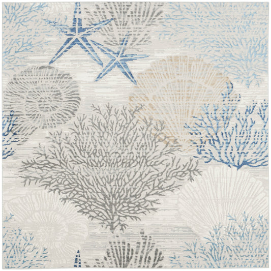 Coastal area rug with blue, gray and beige coral and starfish motifs on a light neutral background.