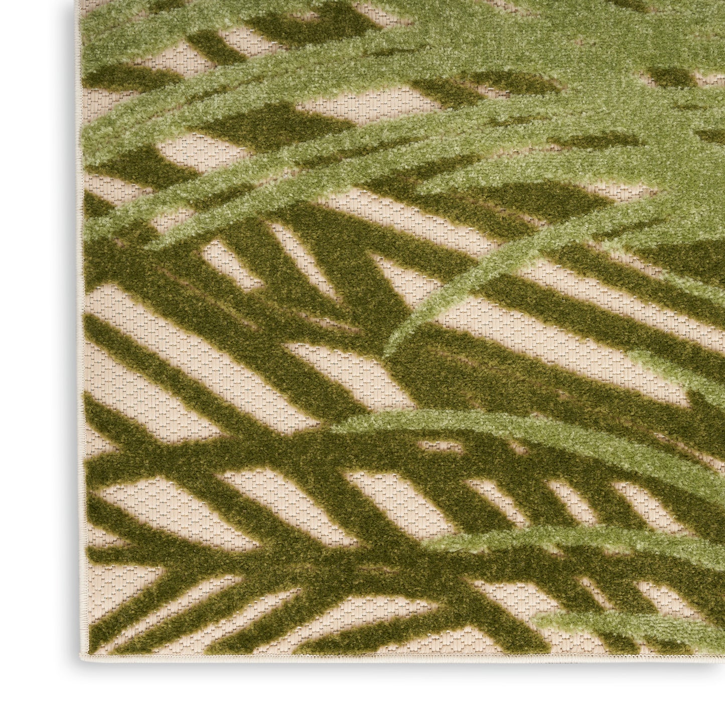 Rectangular beige outdoor woven rug 4' x 6' with olive-green palm-frond pattern; textured botanical design.