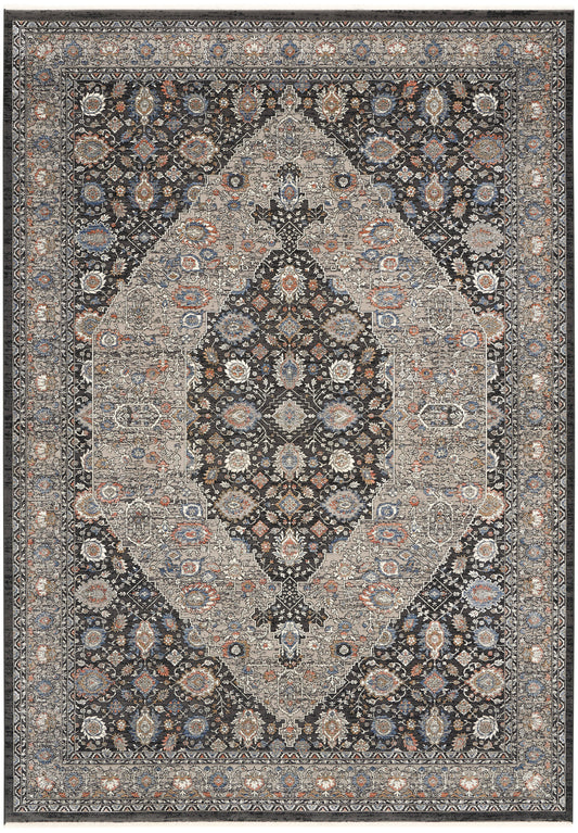 Persian-style area rug with intricate central medallion, navy field, cream, blue and rust floral motifs, bordered edges