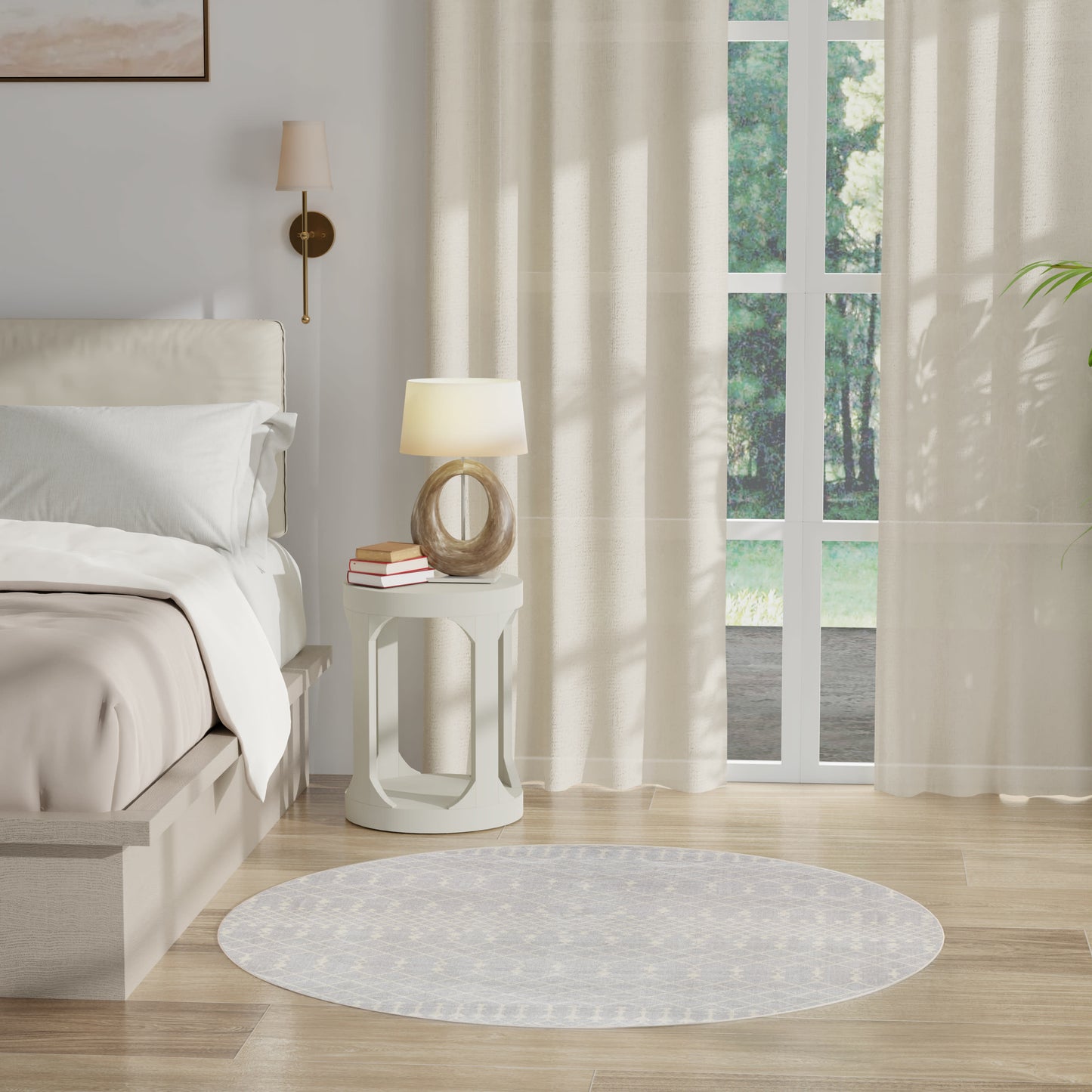 Neutral bedroom with white bedding, round white nightstand, curved glass lamp, books, beige curtains, window, circular rug.
