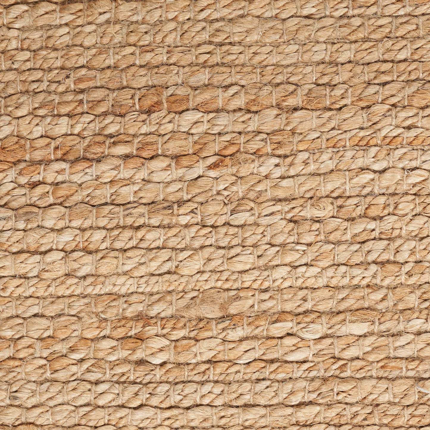 Close-up of natural jute rope weave in beige and tan tones; rustic, textured rug, 7' x 10'.