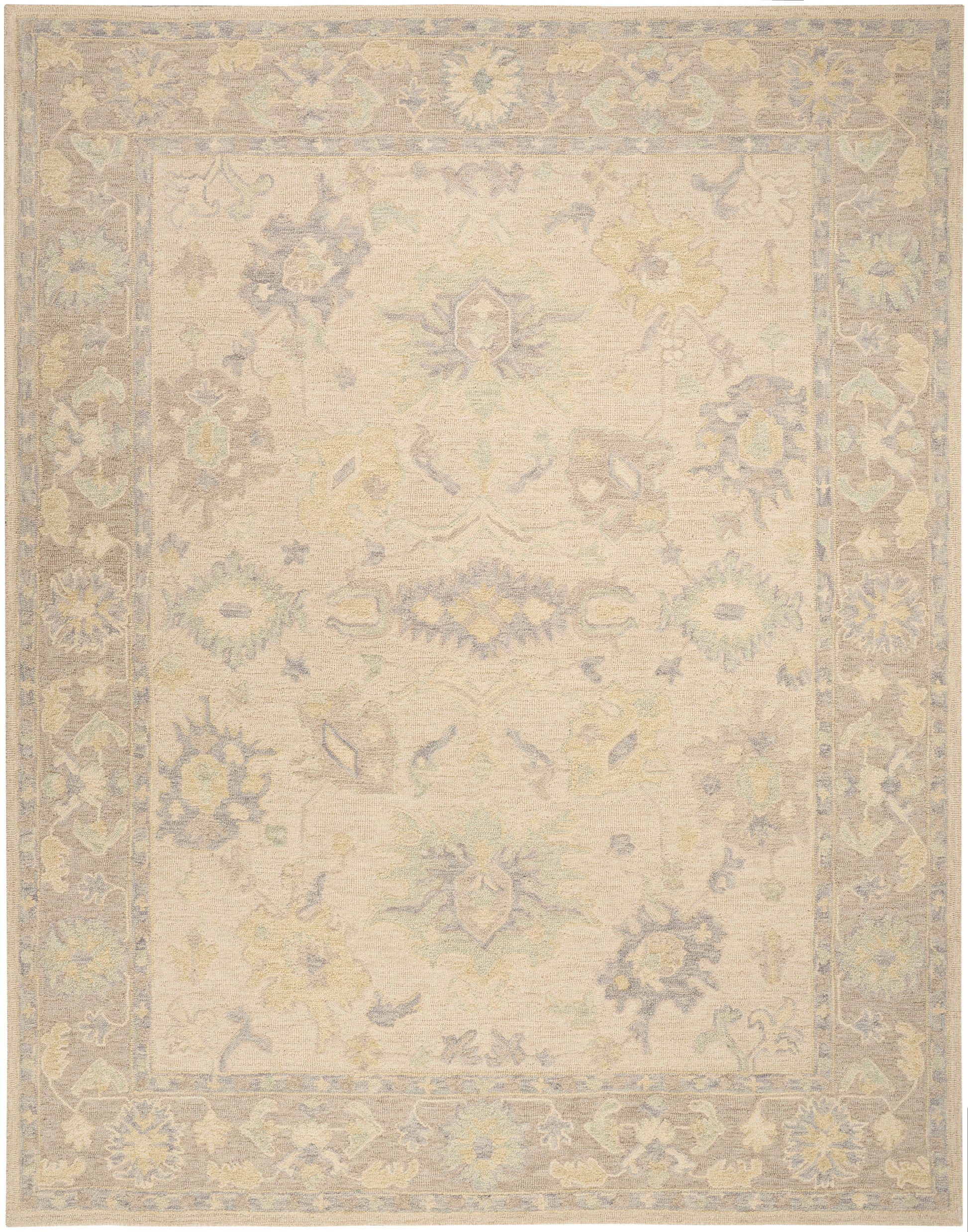Soft beige ornamental rug with pastel blue, yellow and green florals, central medallion and decorative border.
