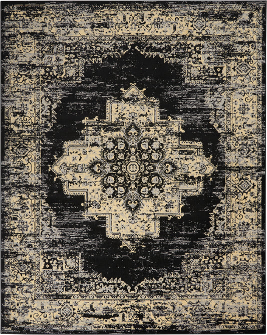 Distressed vintage Oriental rug in black & ivory with a central floral medallion and ornate border.