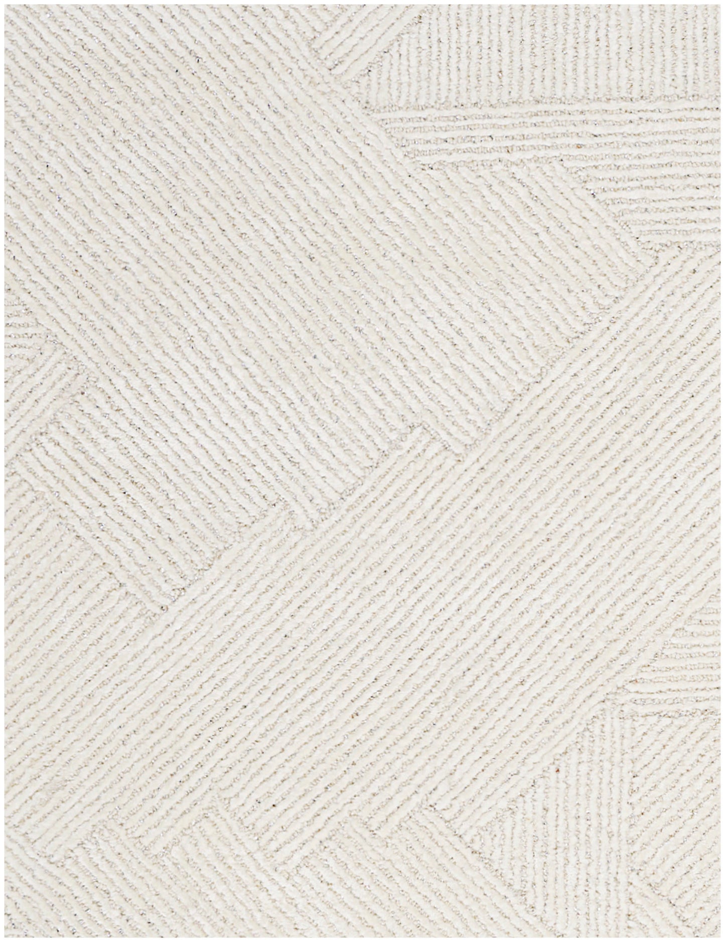 Cream textured rug featuring geometric patchwork with diagonal ribbed rectangles.