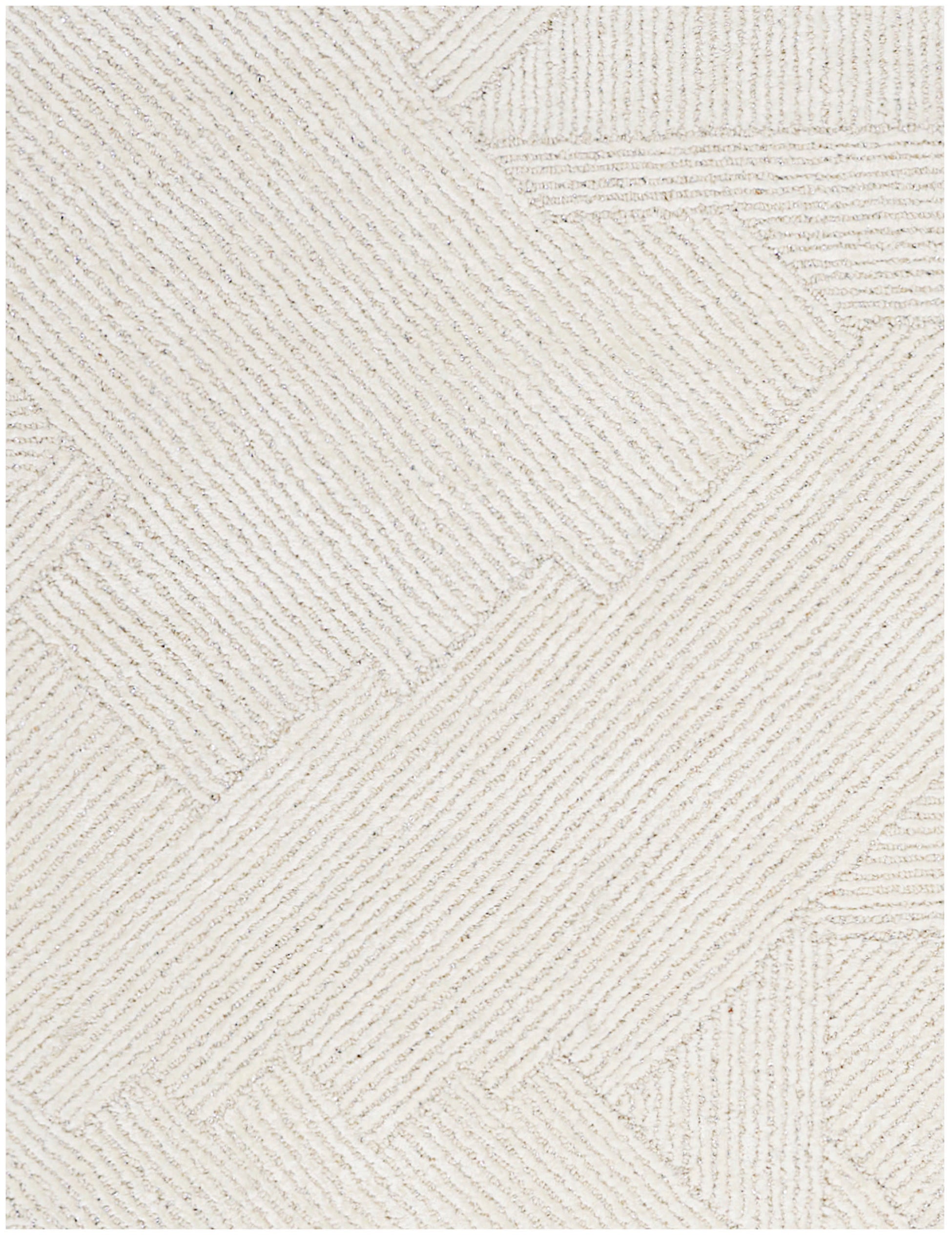 Cream textured rug featuring geometric patchwork with diagonal ribbed rectangles.