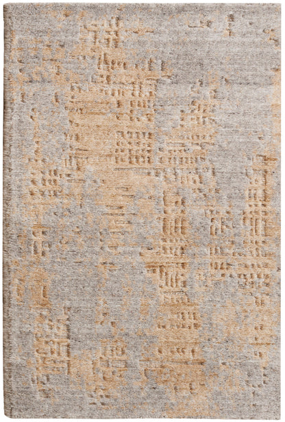 Abstract beige and gray area rug with distressed geometric texture and soft plush pile.