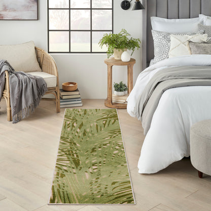 Green botanical outdoor runner on a wooden deck.