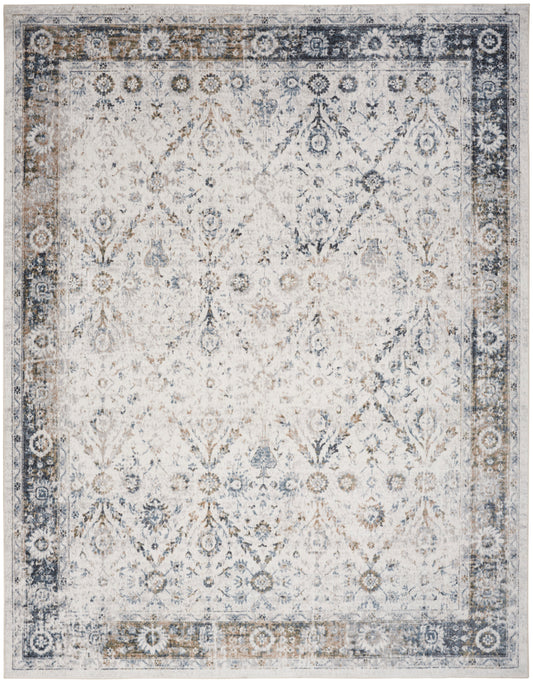 Rectangular distressed oriental area rug in ivory cream with blue-gray border and intricate diamond floral pattern.