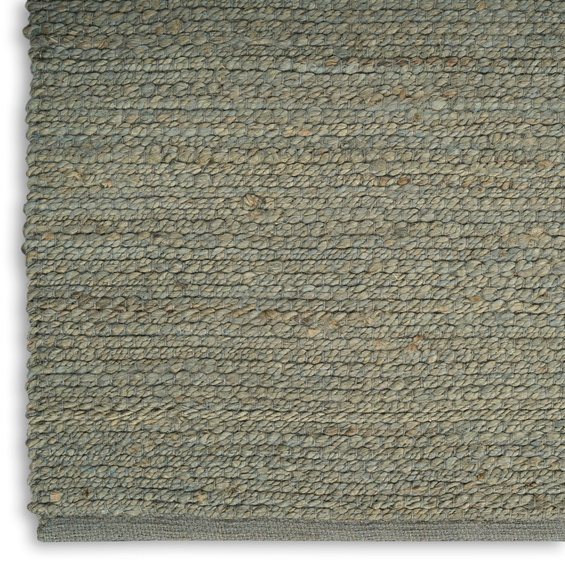 Close-up of an olive-gray loop-pile rug with dense woven loops and a bound edge.