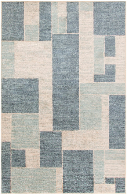 Geometric patchwork rug in blue and cream tones with rectangular blocks; modern woven design.