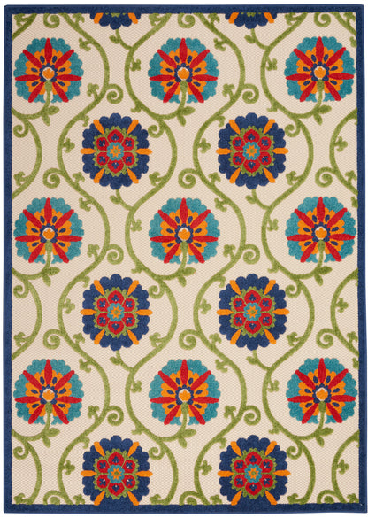 Rectangular rug with cream background, green vines and colorful floral medallions in teal/red and blue, navy border.