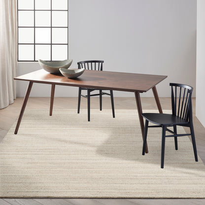 Beige modern area rug with subtle pattern.