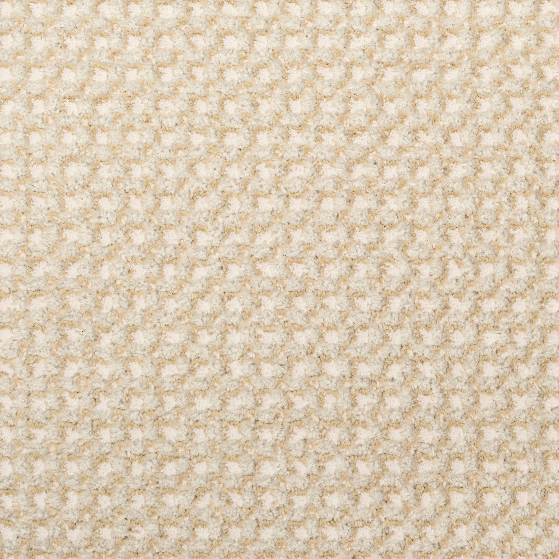Beige textured fabric with a small raised waffle pattern; cozy plush material for blankets or upholstery.
