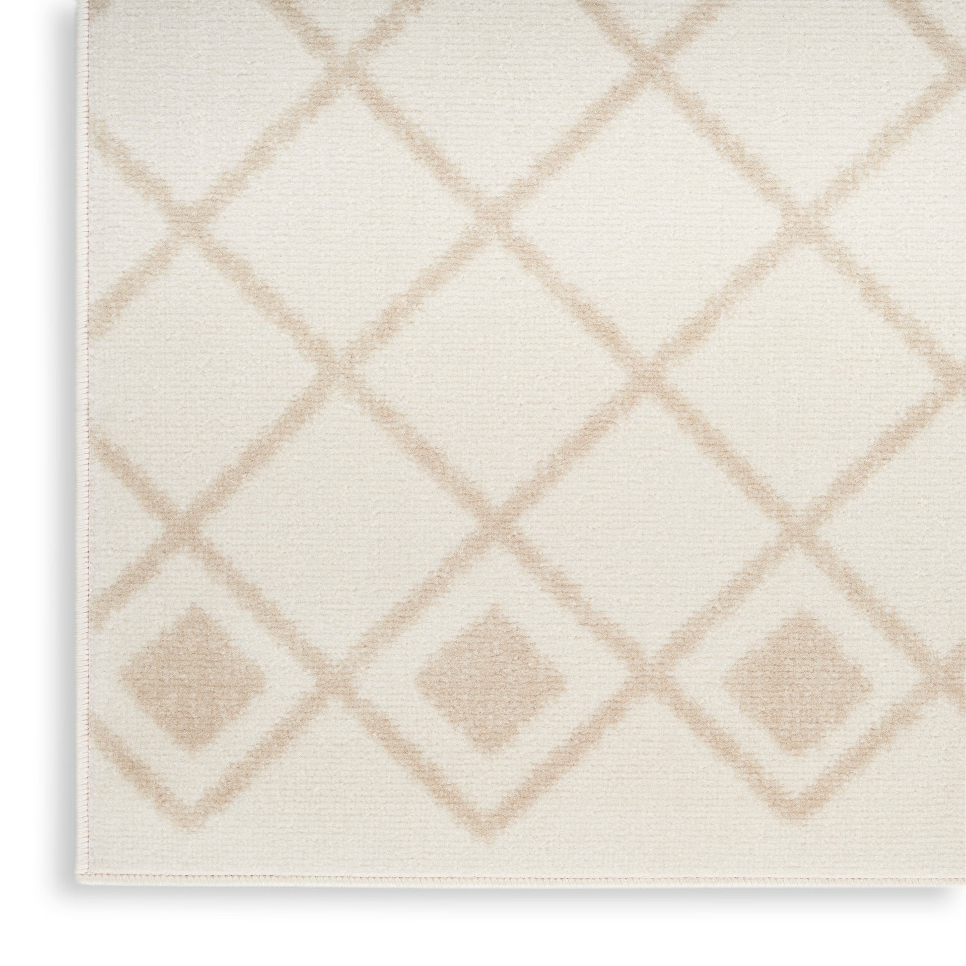 Cream woven rug with pale tan diamond lattice pattern and subtle border.