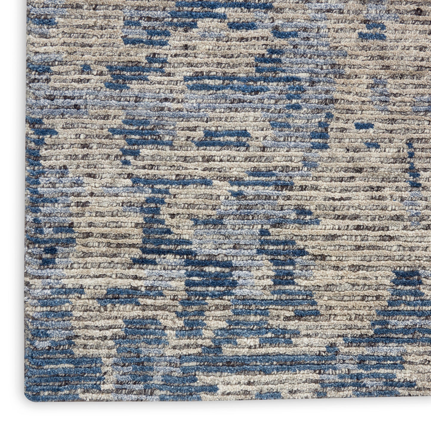 Beige and blue textured rug with abstract geometric pattern; woven pile for a modern decorative floor covering.