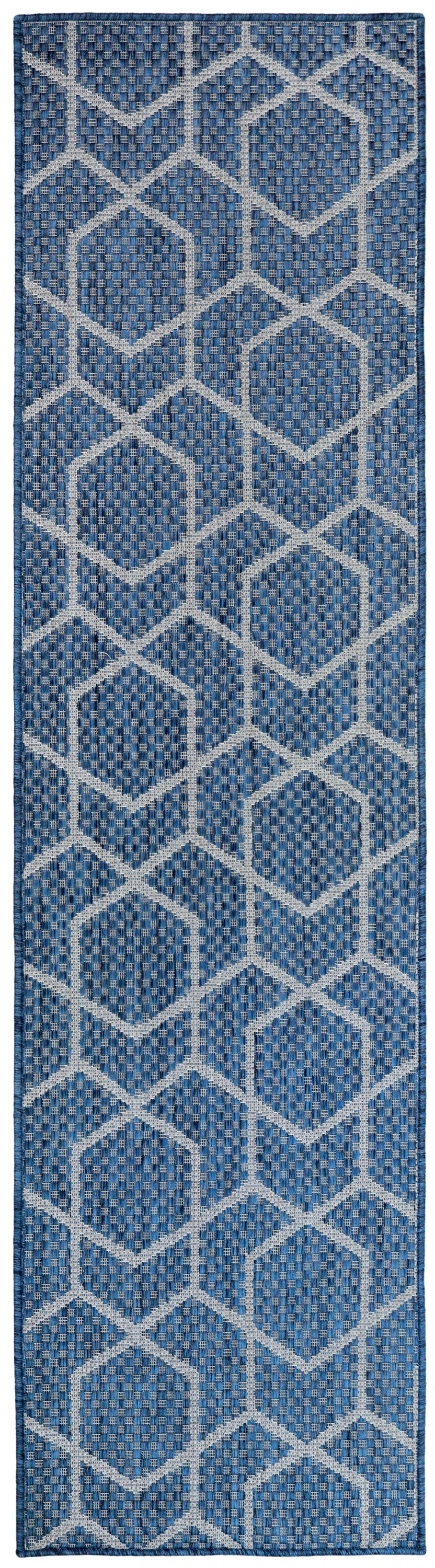 Blue woven rug runner with white geometric diamond lattice pattern; indigo hues and dark border.