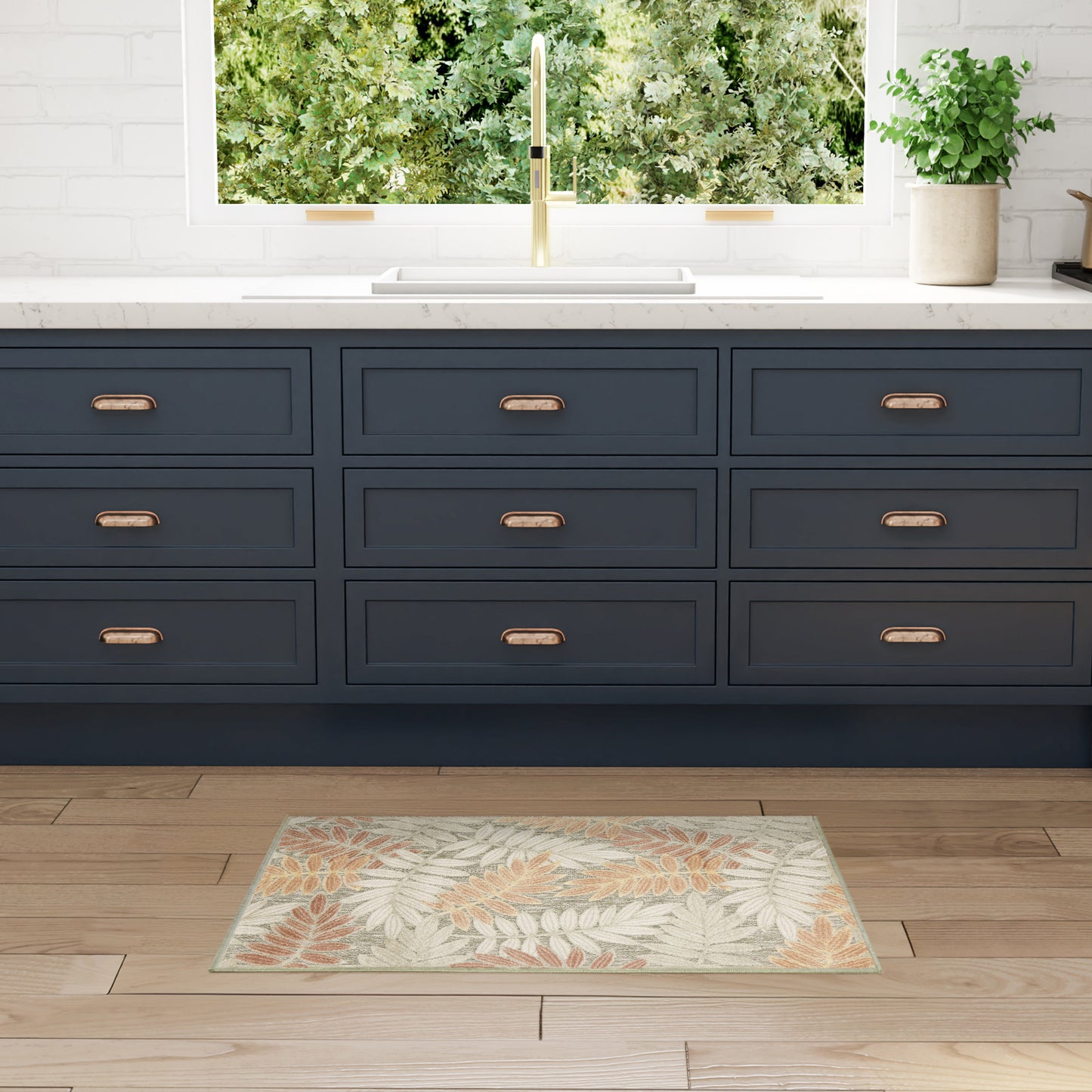 Dark navy leaf-patterned rug on a wooden floor.