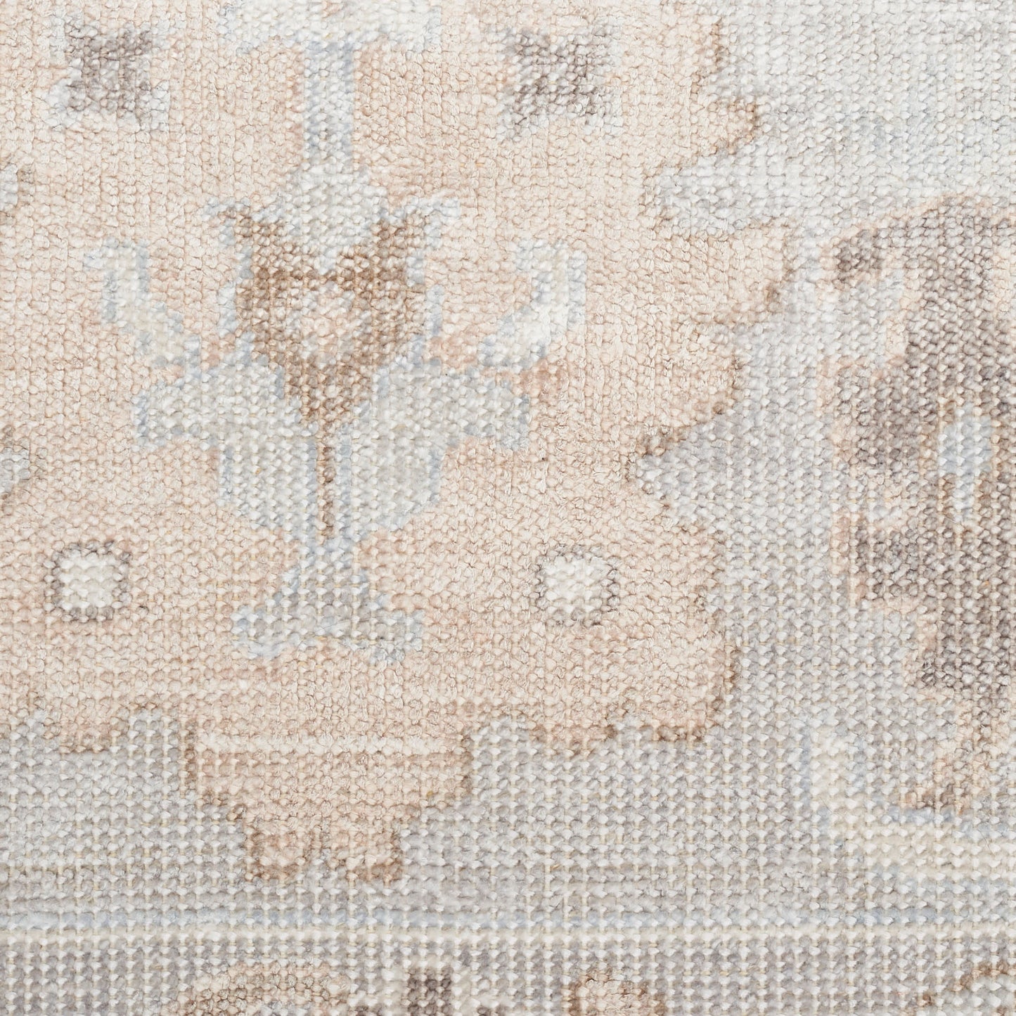 Neutral woven rug with soft beige, ivory and taupe tones; subtle floral arabesque pattern and distressed texture.