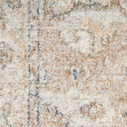 Close-up of a neutral-toned shag rug with cream, beige, tan and pale blue accents; soft textile texture.
