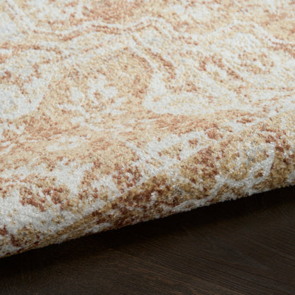 Close-up of a plush cream and beige oriental rug with tan accents, folded edge over dark wood floor.