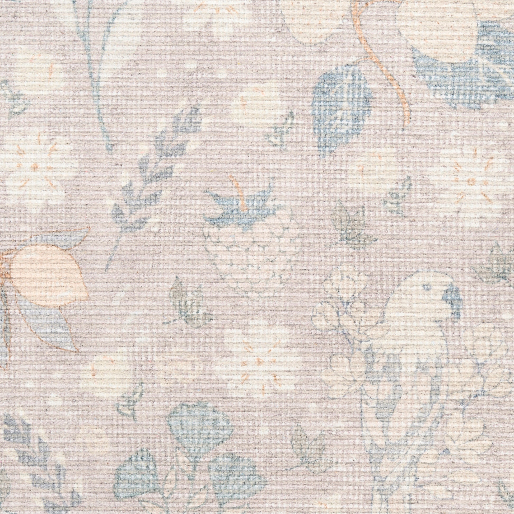 Pastel floral woven rug with beige background, featuring blue and peach blossoms and a soft textured surface.