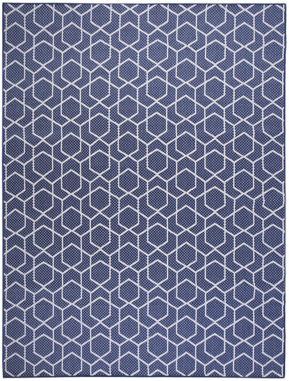 Navy blue rug with white hexagon lattice pattern; modern geometric flat-weave for contemporary living spaces.