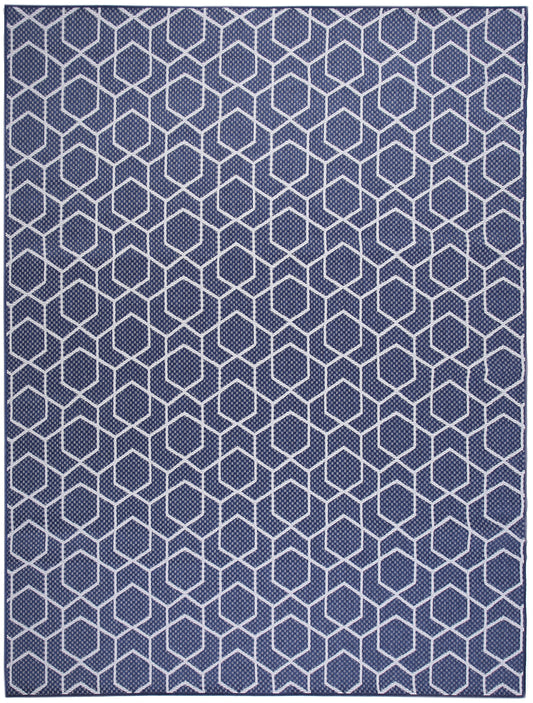 Navy blue rug with white hexagon lattice pattern; modern geometric flat-weave for contemporary living spaces.
