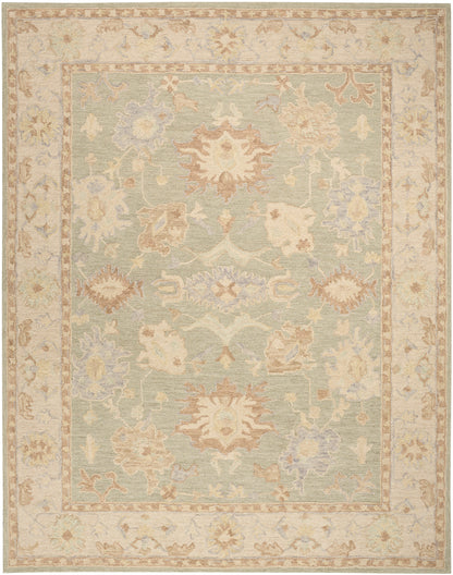 Pastel Persian-style rug with pale green center, cream and peach floral motifs and beige border.