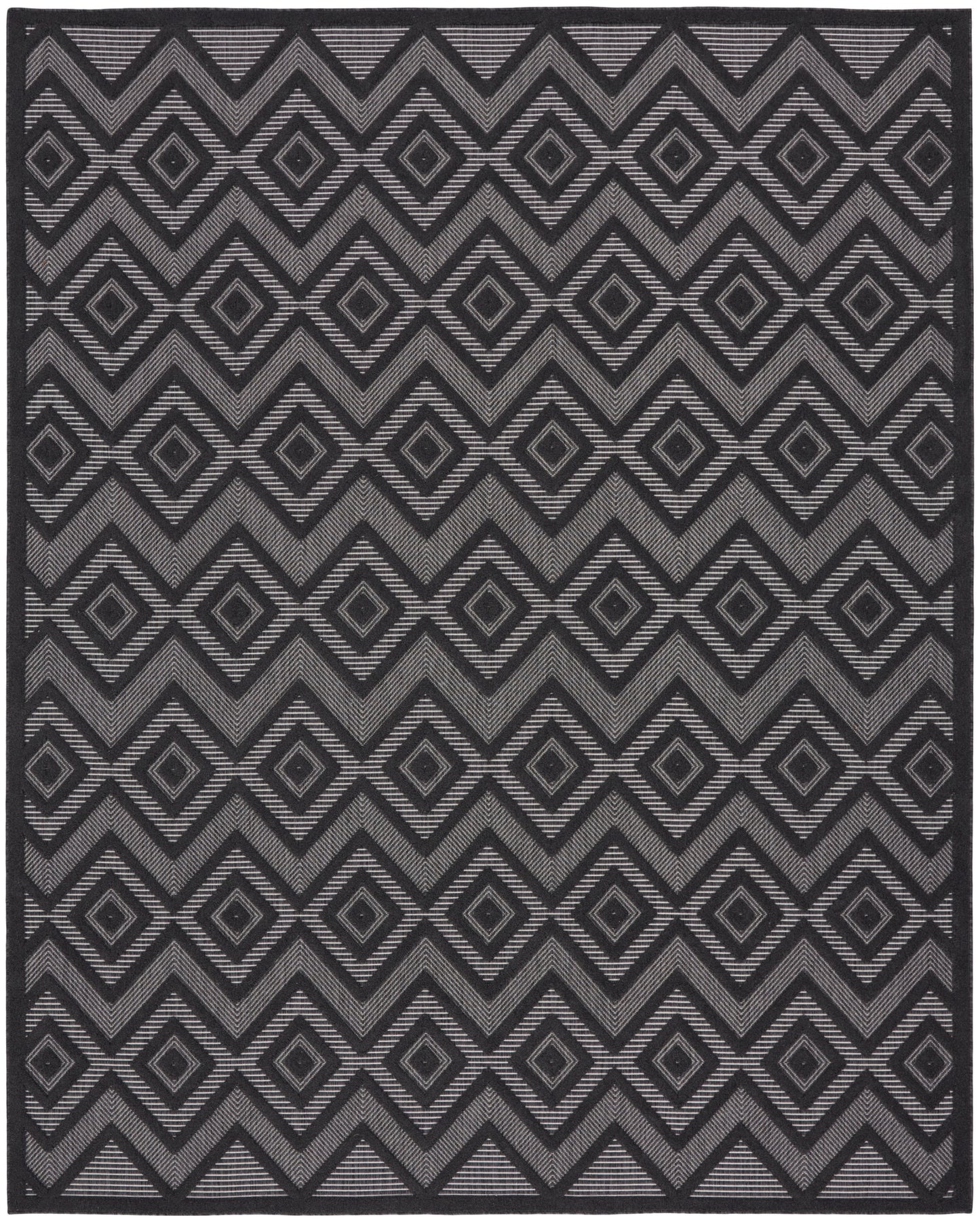 Dark gray woven rug with repeating diamond and chevron pattern in lighter gray; rectangular, modern geometric decor.