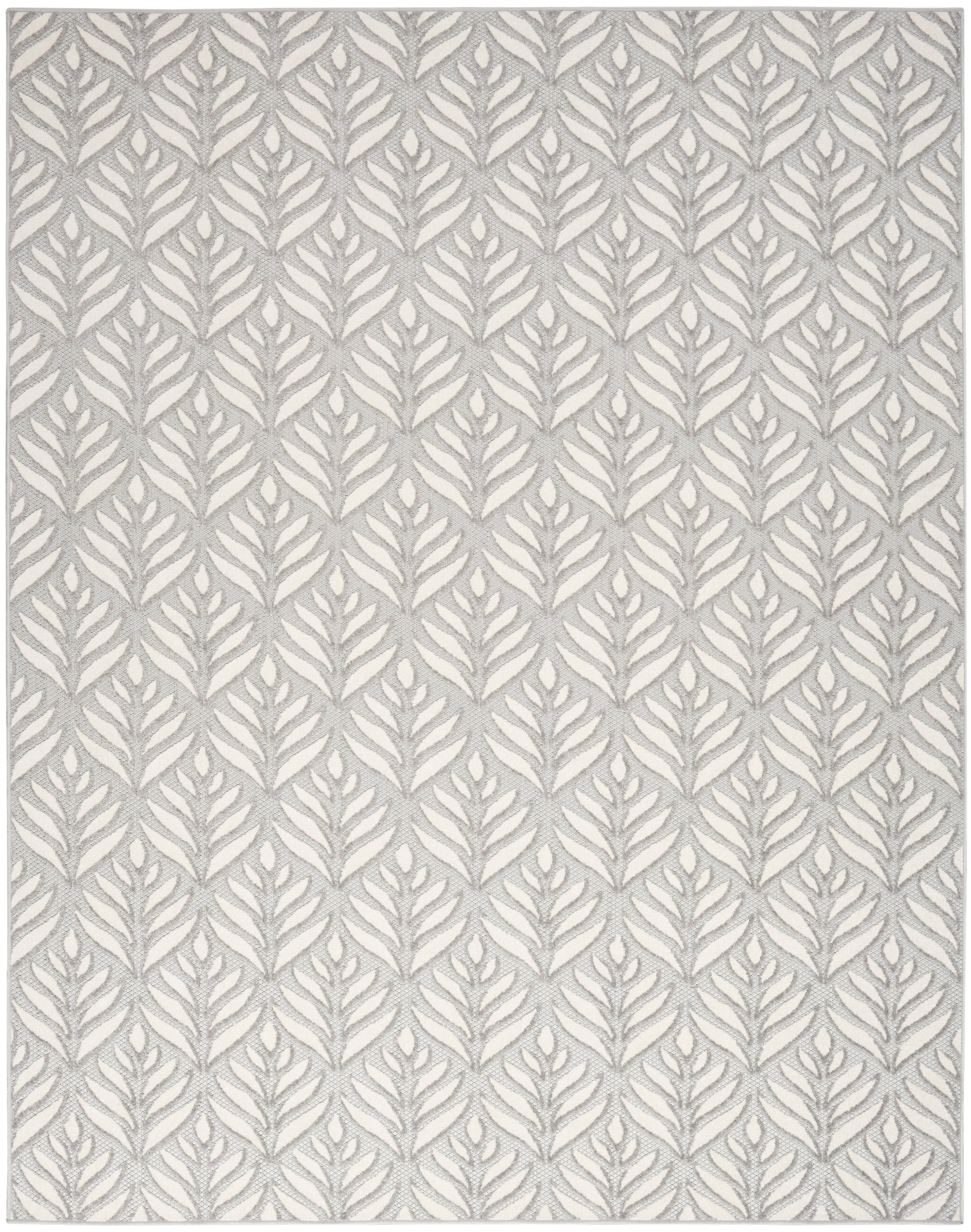 Rectangular rug with grey fern motif on ivory background; modern botanical woven pattern.