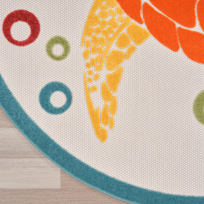 Round woven rug with orange koi fish design, yellow scales, teal border and ring accents on light wood floor.
