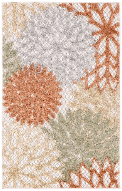 Rectangular area rug with large starburst floral medallions in cream, rust, tan, sage and gray on beige background; soft textured decor.