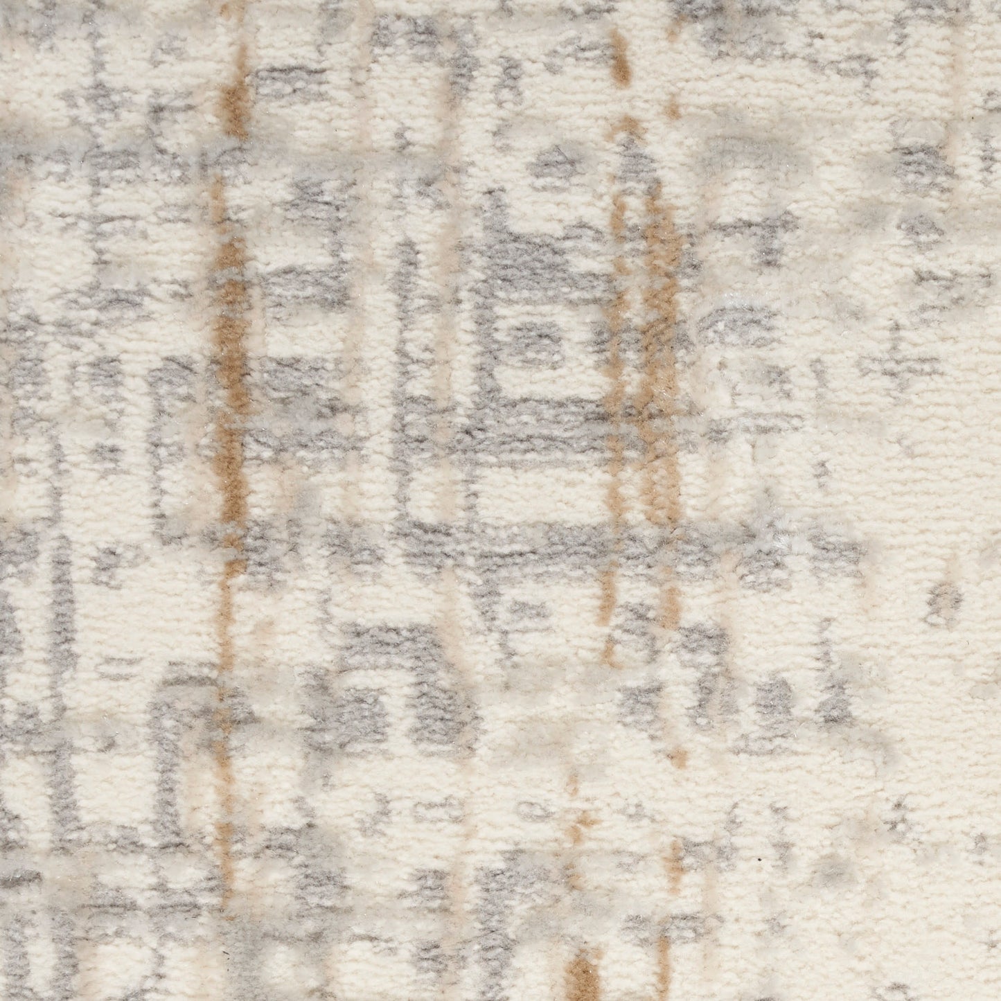 Cream plush pile rug with gray geometric motifs and subtle brown accents; soft, versatile home decor.