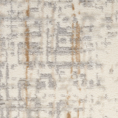 Cream plush pile rug with gray geometric motifs and subtle brown accents; soft, versatile home decor.