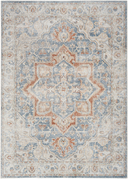 Distressed oriental woven area rug with blue, ivory, rust tones; central medallion pattern, vintage floral border.