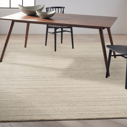 Beige woven area rug, 10' x 14', on floor.
