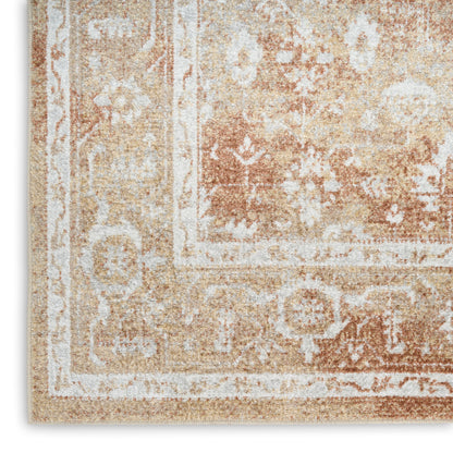 Beige vintage-style rug with ivory floral border and distressed warm-toned pattern.