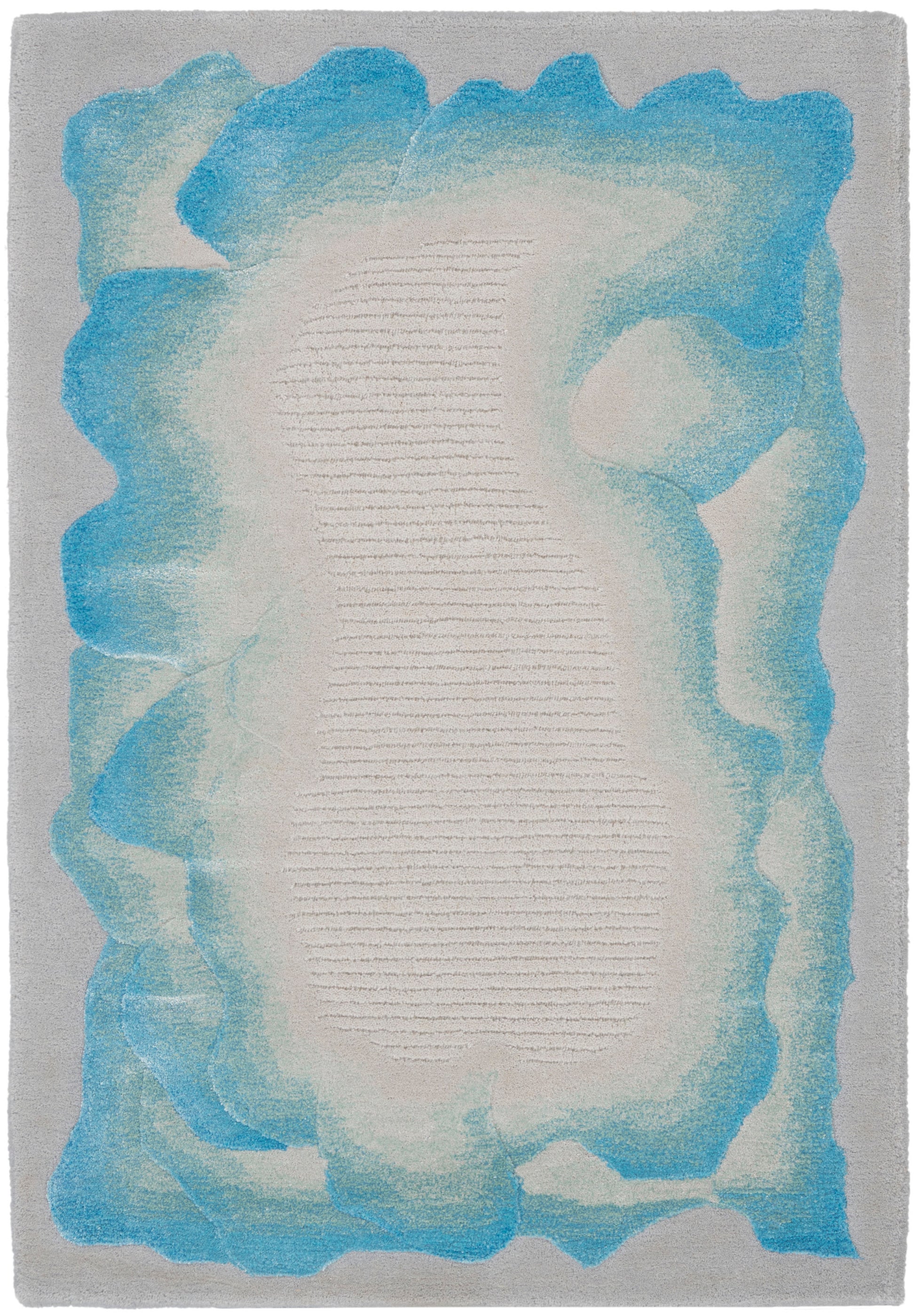 Rectangular abstract rug with cream center, teal-blue gradient border, soft textured look, contemporary ocean-inspired decor.