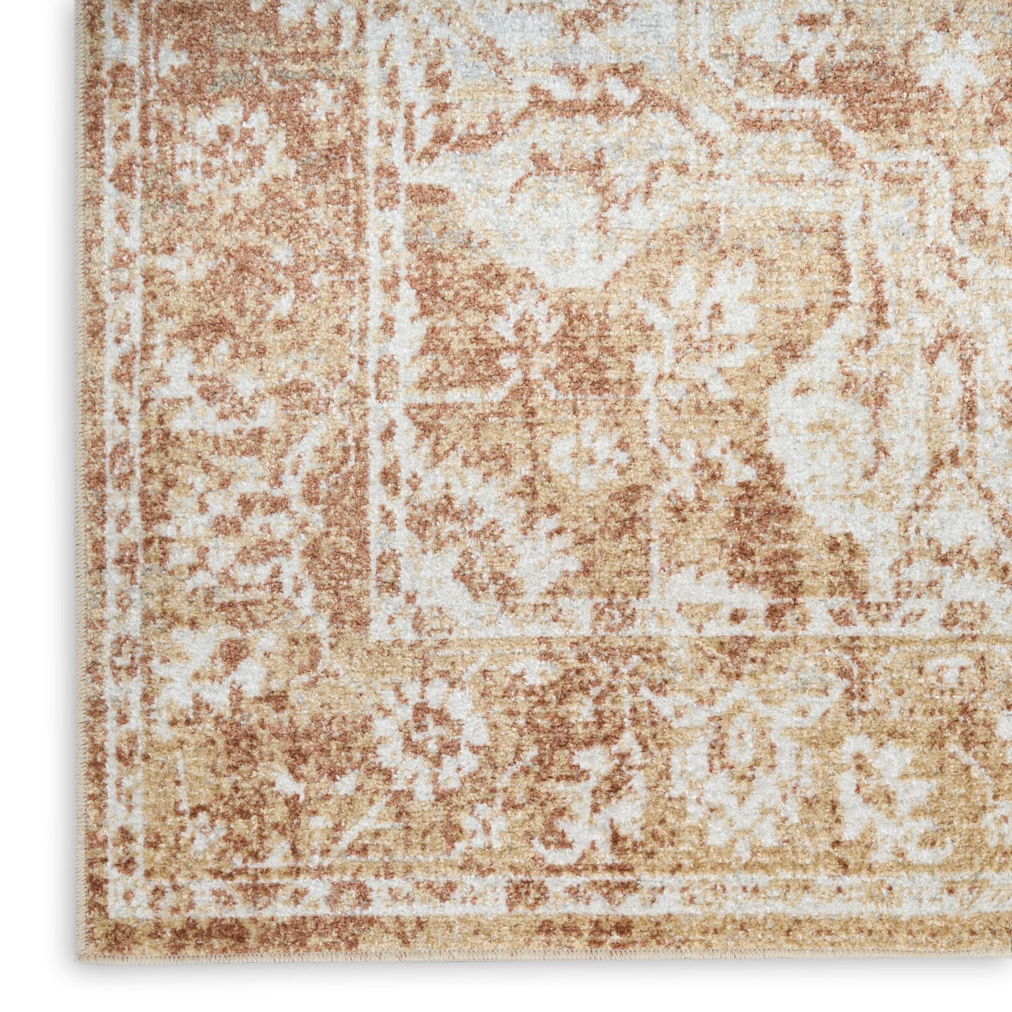 Beige & tan distressed oriental rug with floral motif & decorative border.