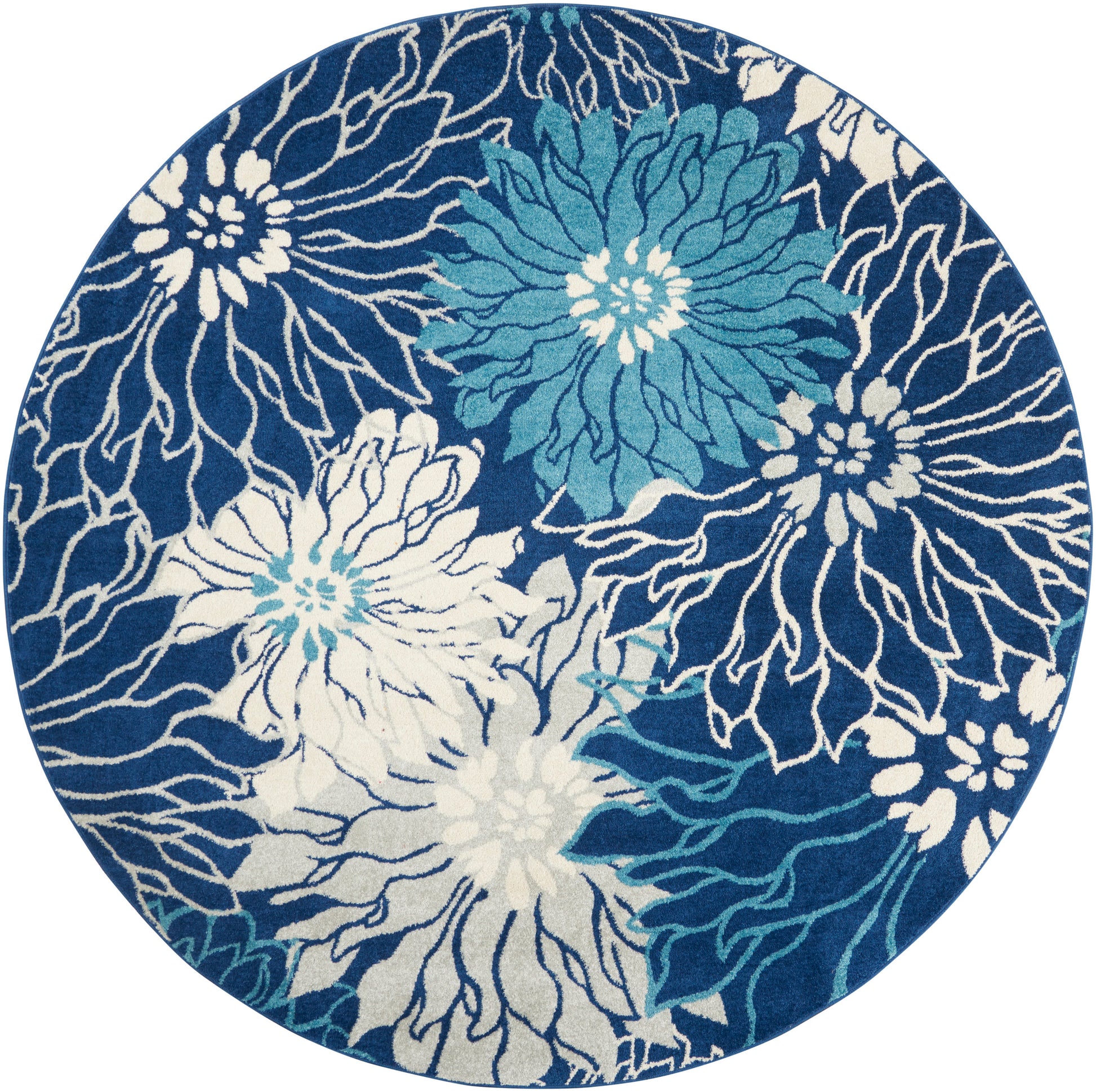 8' round rug with navy background and bold white and teal floral motifs, contemporary style.